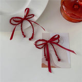 Boogzel Apparel Coquette Red Bow Earrings, view 3