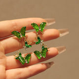 Boogzel Apparel Fairy Butterfly Green Earrings, view 2