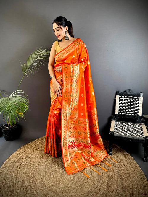 Dista Elora Orange Banarasi Lichi Silk Meenakari Zari Weaving Patola Saree