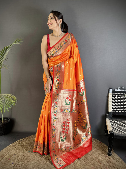 Dista Elora Orange Lichi Silk Ikkat Floral Motifs Zari Woven Paithani Saree