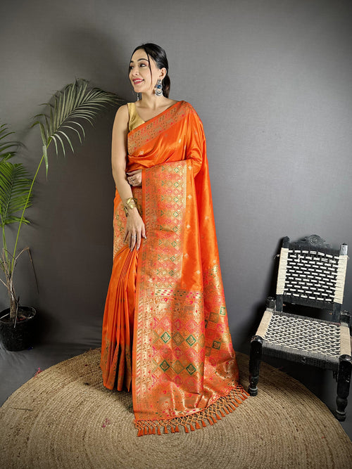 Dista Elora Orange Soft Lichi Silk Multicolour Minakari Zari Weaving Patola Saree