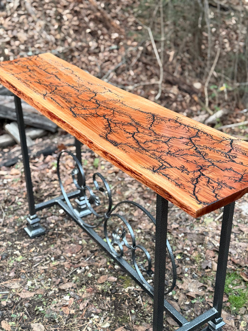 Foxcreek Baskets Console Table- Fractal Burn Patagonian Rosewood with Live edge and metal powder coated frame with scrollwork