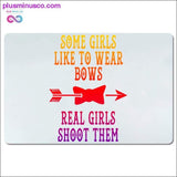 Plus Minus Co Some girls like to wear bows real girls shoot them Desk Mats, view 3