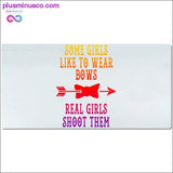Plus Minus Co Some girls like to wear bows real girls shoot them Desk Mats, view 4